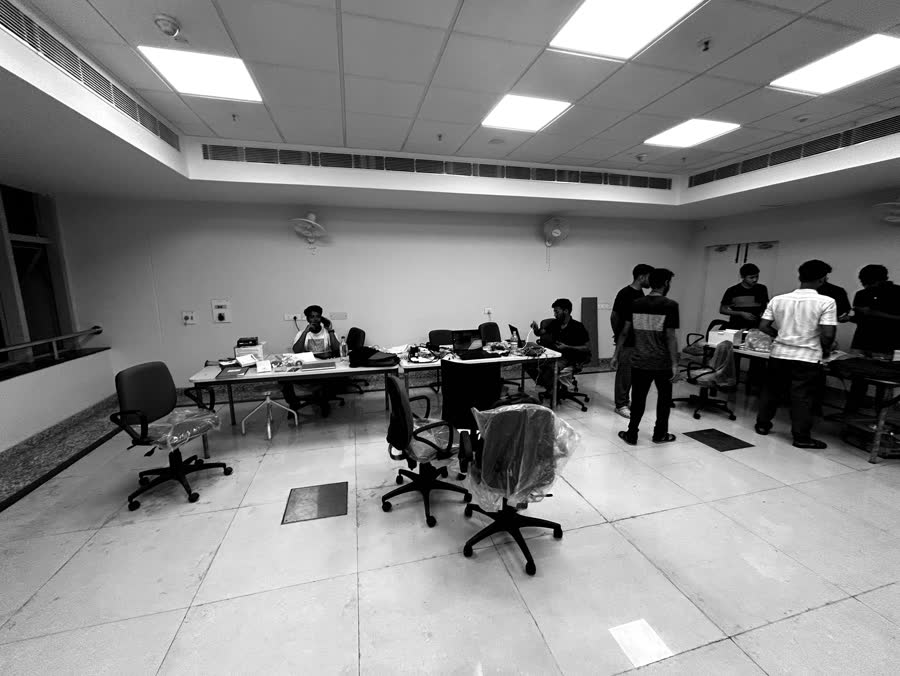The RoboCell lab with members working at benches